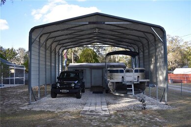 RV Carport with a shed in the back.