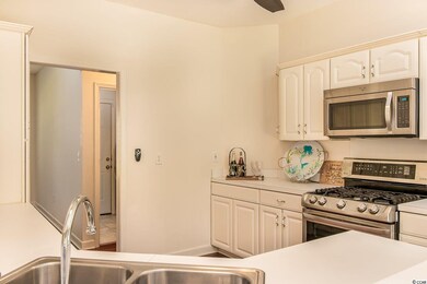 Newer Stainless appliances, and white cabinetry.