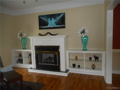 Formal living room FP w/side built in cabinets, no