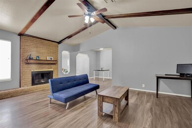 Living room featuring wood-type flooring, lofted c