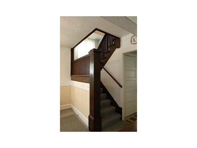 Other. A beautiful wood staircase highlights the e