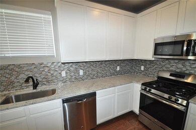 Kitchen  Can lights, flat panel cabinets, upscale 