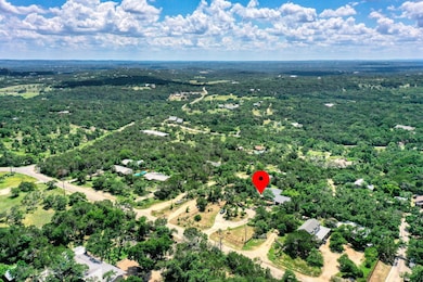 Aerial view of property and surrounding area with