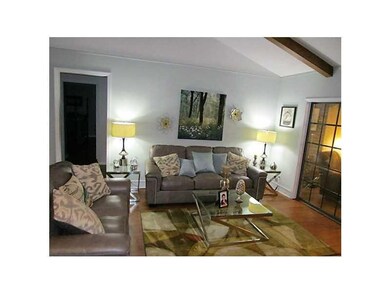 Living Room. Cathedral ceiling with exposed beams.