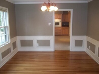 Seperate formal dining room with fresh paint & har