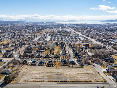 Birds eye view of property with a residential view and a mountain view