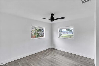 Empty room featuring light wood-type flooring and ceiling fan