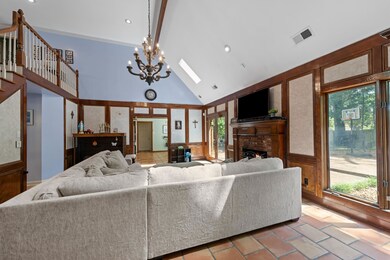 Living area with a notable chandelier, plenty of n