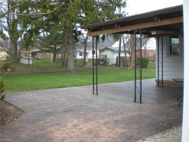 GREAT BIG STAMPED CONCRETE PATIO AND A LEVEL BACK YARD