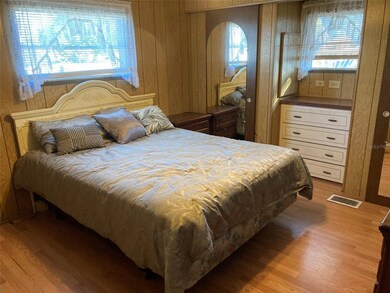 Note two wall closets on either side of the dresse