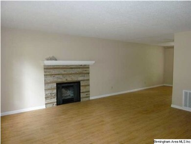 Stacked rock wood burning fireplace....New hardwoo