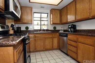 Beautiful kitchen with granite counters, tile floo