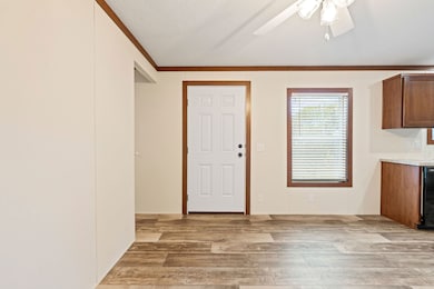 Interior entry view featuring Cafe Au Lait vinyl flooring and Caramel trim