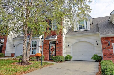View of front of home  featuring a garage