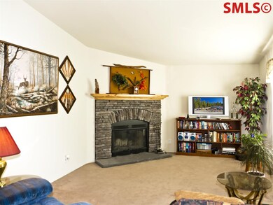 A fireplace sets the mood for this great room. A s