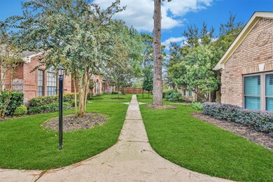 Gated courtyard in The Retreat At Lakewood Forest. Well maintained yard with visitor parking and personal 2 car attached garage.