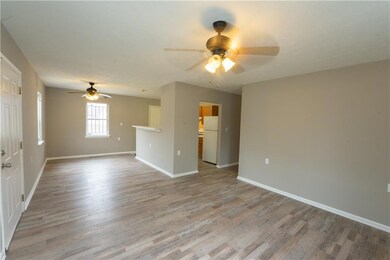 Spare room featuring ceiling fan, wood finished fl