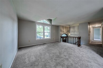 Open and airy formal living room with large pictur