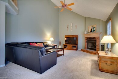 The family room with fireplace and lofted ceiling 
