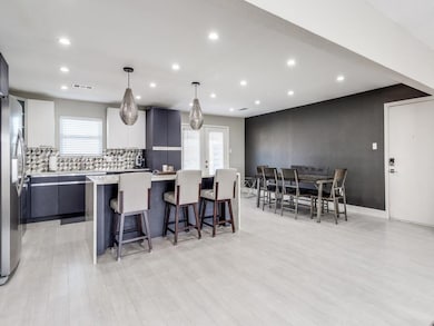 Kitchen featuring stainless steel fridge, a kitche