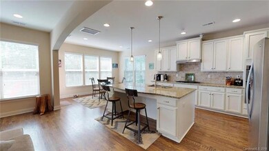 Open concept kitchen with X-LG island with sink an