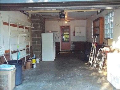 Single garage with storage room.  The fridge in th