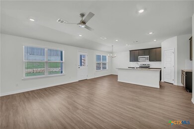 Open concept family, kitchen and dining.