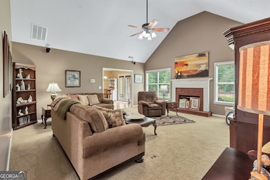 Vaulted ceiling, fireplace plumbed for natural gas logs, electrical outlets in floor for furniture placement