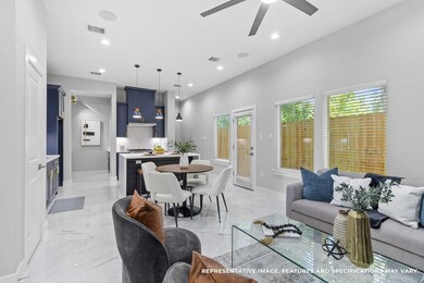 From the living room, you love how the open layout keeps the kitchen and dining area within view, making conversations flow effortlessly while you cook or entertain.