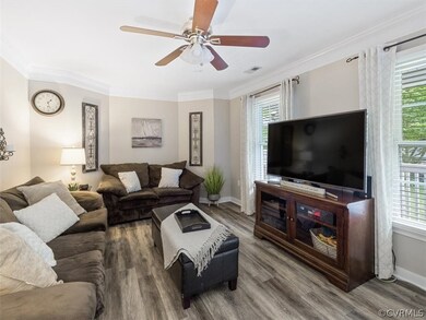 The Great Room with LVP flooring, ceiling fan with