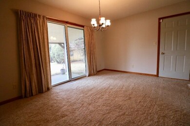 Has sliding door that goes out to covered patio.