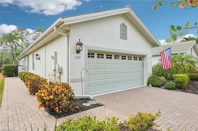 Garage featuring decorative driveway