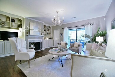 LIVING ROOM WITH BUILT IN BOOK CASES