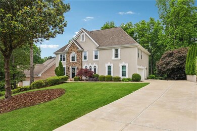 Colonial-style house with concrete driveway, a gar