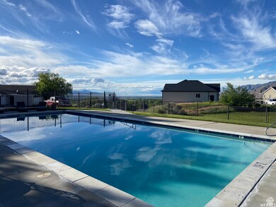 Community pool featuring a mountain view and a patio