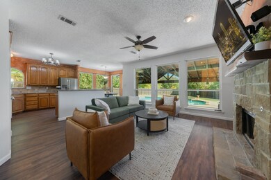 Family room overlooks the stunning back yard pool and large covered patio. New window installed downstairs.