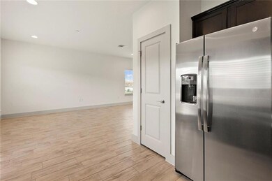 Kitchen with stainless steel fridge with ice disp