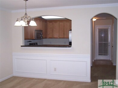 Dining area open to great room and kitchen with ba