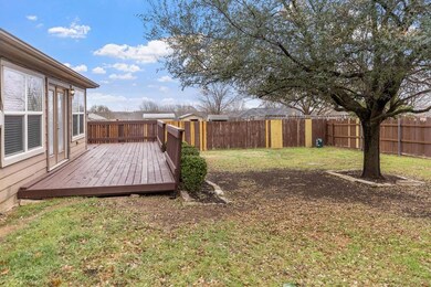 View of yard with a deck and a fenced backyard