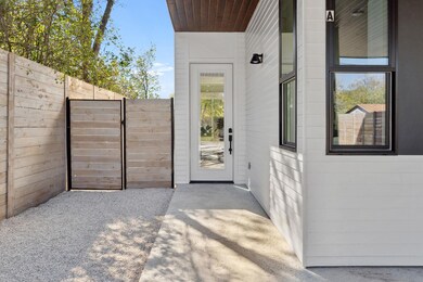 Entrance to property featuring fence and a gate