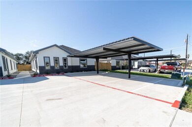 View of front of house with a carport