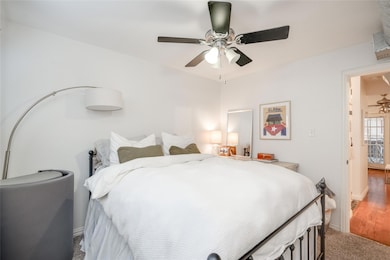 Bedroom with carpet flooring and ceiling fan