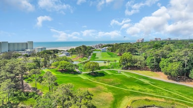 Bird's eye view of a large body of water, a golf c