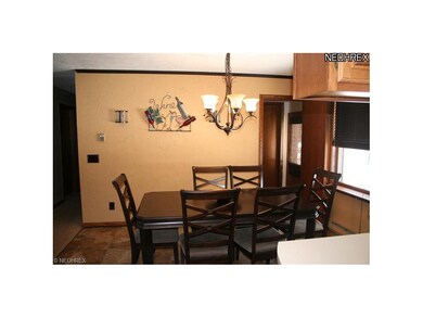 Dining room with crown molding and ceramic floorin