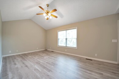 Spacious Living Room with lots of natural light. Look at the beautiful new floors!!!