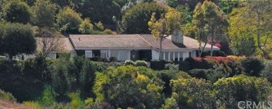 Looking across to the home you see the lush landsc