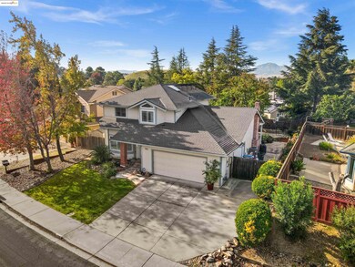 Traditional-style home with driveway, roof with shingles, a chimney, a garage, and a mountain view