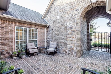 Note the drain at the center of the courtyard.  The drain terminates at the street and has kept up with all major flooding events since 2011 when the house was built.