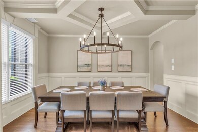 Dining area with arched walkways, dark wood-style 