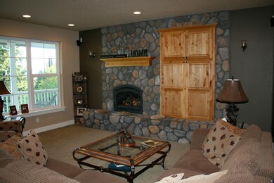 GREAT ROOM W/RIVER ROCK FIREPLACE